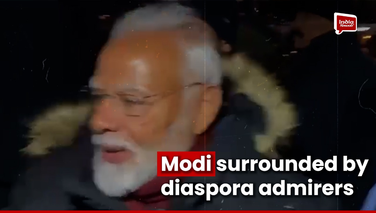 Modi surrounded by diaspora admirers